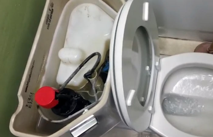 Vacuum-assisted toilet